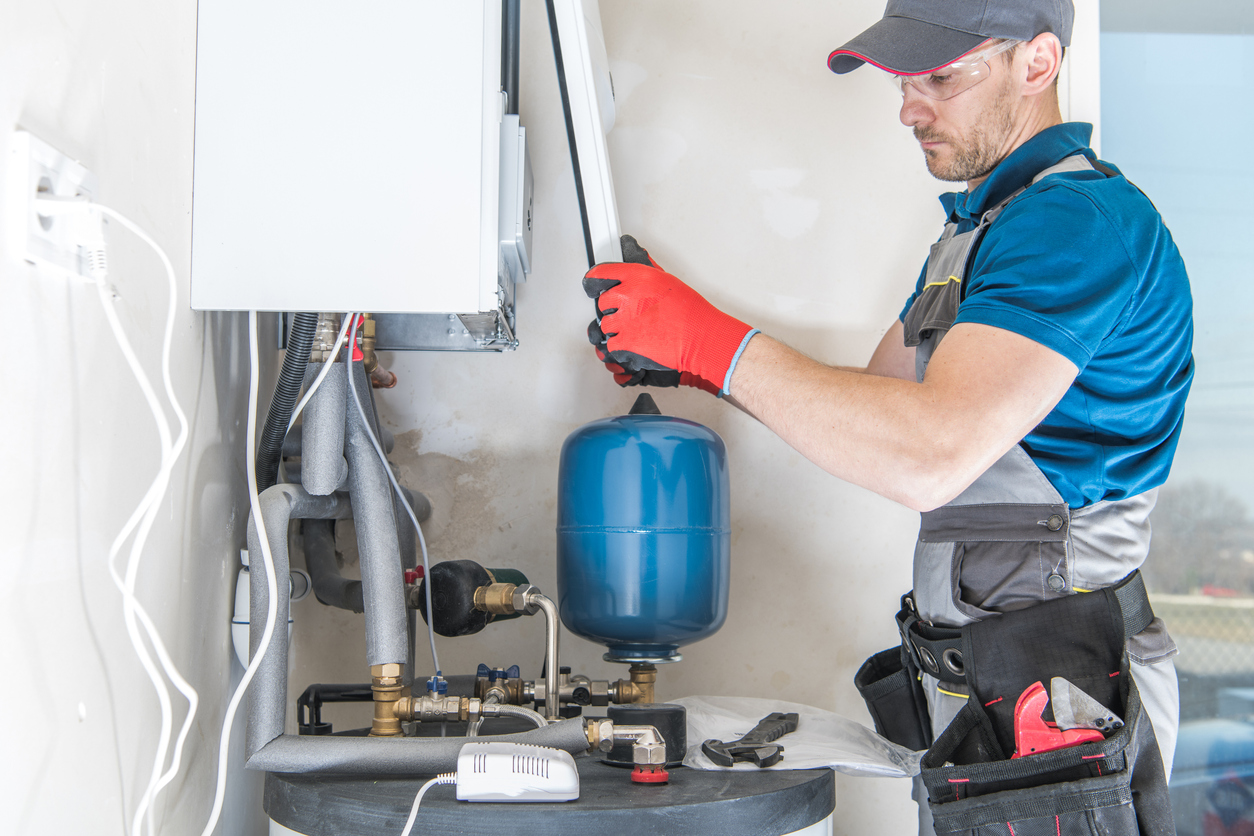 HVAC technician installing a gas-powered heating system