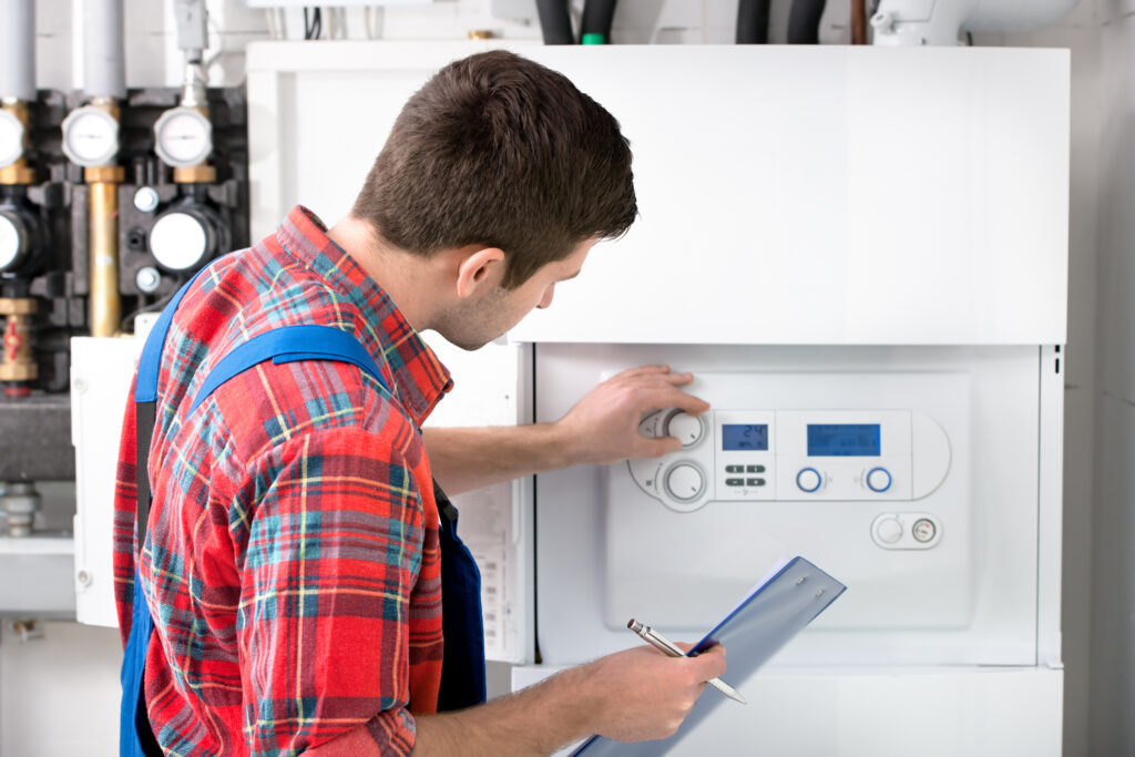 Technician installing a gas boiler