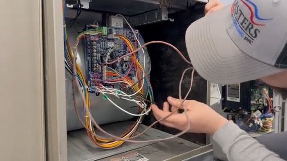 HVAC technician replacing an Indiana home’s boiler